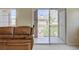 Comfortable living room with a balcony overlooking mountain views at 3825 Ormond Beach St # 203, Las Vegas, NV 89129
