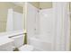 Bathroom with white shower tub and vanity, plus a curtain and showerhead fixture at 3825 Ormond Beach St # 203, Las Vegas, NV 89129