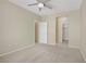 Bedroom featuring a ceiling fan and closets access, enhancing its spacious appeal at 3825 Ormond Beach St # 203, Las Vegas, NV 89129
