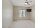 A bright bedroom featuring a ceiling fan, a TV, and a window with natural light at 3825 Ormond Beach St # 203, Las Vegas, NV 89129