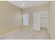 Neutral bedroom featuring a ceiling fan, closet, and a window with blinds for ample light at 3825 Ormond Beach St # 203, Las Vegas, NV 89129