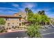 An exterior shot of a condo with palm trees and mountains in the distance at 3825 Ormond Beach St # 203, Las Vegas, NV 89129