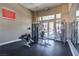 Well-equipped fitness center with modern exercise machines, mirrors, and natural light streaming through the glass doors at 3825 Ormond Beach St # 203, Las Vegas, NV 89129