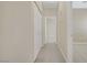 Hallway with carpet flooring, neutral walls and doors leading to other rooms, with closet at 3825 Ormond Beach St # 203, Las Vegas, NV 89129