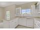 Bright kitchen with white cabinetry, stainless appliances, and countertop space at 3825 Ormond Beach St # 203, Las Vegas, NV 89129