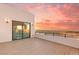 Sunset view from the expansive tiled balcony at 394 Solitude Peak Ln, Henderson, NV 89012