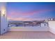 Balcony with scenic city views under twilight sky, offering relaxation and outdoor enjoyment at 394 Solitude Peak Ln, Henderson, NV 89012
