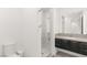 Bathroom featuring sleek vanity and glass enclosed shower at 394 Solitude Peak Ln, Henderson, NV 89012
