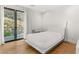 Bright bedroom with hardwood floors and walkout patio at 394 Solitude Peak Ln, Henderson, NV 89012