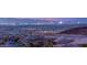 Spectacular Las Vegas city skyline with mountains at dusk, showcasing vibrant lights and community at 394 Solitude Peak Ln, Henderson, NV 89012