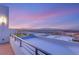 Rooftop deck with stunning city views during twilight, perfect for outdoor entertaining and relaxation at 394 Solitude Peak Ln, Henderson, NV 89012