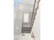 Modern staircase with custom railing design and natural light from above at 394 Solitude Peak Ln, Henderson, NV 89012