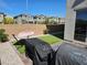 Low maintenance backyard with a hammock, artificial turf, and brick pavers at 4109 Cloudless Ave, North Las Vegas, NV 89081