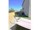 Relaxing backyard offers a hammock, artificial turf, and low maintenance landscaping at 4109 Cloudless Ave, North Las Vegas, NV 89081