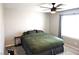 Relaxing bedroom with a comfortable bed, ceiling fan, soft lighting, and a serene atmosphere at 4109 Cloudless Ave, North Las Vegas, NV 89081