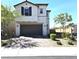 Charming two-story home features a brown garage door and desert landscaping at 4109 Cloudless Ave, North Las Vegas, NV 89081
