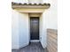 Front entrance featuring a black front door, stone accents, and a brick walkway, creating a welcoming entrance at 4109 Cloudless Ave, North Las Vegas, NV 89081
