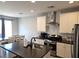 Modern kitchen featuring white cabinets, stainless steel appliances, and center island at 4109 Cloudless Ave, North Las Vegas, NV 89081