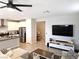 Bright open concept living space with kitchen island, modern appliances, and hardwood floors at 4109 Cloudless Ave, North Las Vegas, NV 89081
