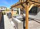 Comfortable outdoor seating area with pergola and brick pavers at 4109 Cloudless Ave, North Las Vegas, NV 89081