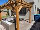 Outdoor patio area featuring a pergola for shade and relaxing seating space at 4109 Cloudless Ave, North Las Vegas, NV 89081