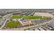Extensive aerial perspective of the community, highlighting the park, recreational facilities, and residential areas at 4145 Lunar Canyon Ave, North Las Vegas, NV 89084