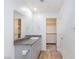 Bright bathroom with a single vanity, granite countertop, and walk-in closet at 4145 Lunar Canyon Ave, North Las Vegas, NV 89084