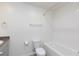 Full bathroom with white subway tiled shower and toilet at 4145 Lunar Canyon Ave, North Las Vegas, NV 89084