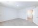 Empty bedroom features neutral carpet, bright walls, and closet at 4145 Lunar Canyon Ave, North Las Vegas, NV 89084