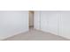 Empty bedroom featuring neutral carpet, bright walls, and closet at 4145 Lunar Canyon Ave, North Las Vegas, NV 89084