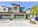 Two-story townhome with a modern design and desert landscaping for low maintenance at 4145 Lunar Canyon Ave, North Las Vegas, NV 89084