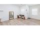 Bright living room with wood floors, lots of natural light, and entryway view at 4145 Lunar Canyon Ave, North Las Vegas, NV 89084
