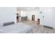 Living space featuring gray wood flooring, kitchen and bedroom at 4145 Lunar Canyon Ave, North Las Vegas, NV 89084