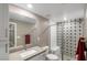 Modern bathroom featuring a glass shower with designer tiles and a vanity with a mirror at 4193 Solace St # 4193, Las Vegas, NV 89135