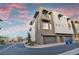 Modern townhome exterior with clean lines, a private balcony, and well-maintained landscaping, showcasing contemporary design at 4193 Solace St # 4193, Las Vegas, NV 89135