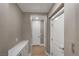 Bright hallway with modern flooring, leading to various rooms, showcasing a clean and well-maintained living space at 4193 Solace St # 4193, Las Vegas, NV 89135