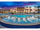 Resort-style pool featuring in-water lounge chairs and ample deck seating for relaxation at 4193 Solace St # 4193, Las Vegas, NV 89135