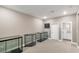 A large room featuring carpeted floors, display cases, and access to other rooms at 4193 Solace St # 4193, Las Vegas, NV 89135