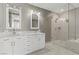 Bathroom featuring double sinks, marble countertop, and glass enclosed shower at 4575 Dean Martin Dr # 1208, Las Vegas, NV 89103
