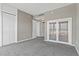 Bedroom with large windows and closet with frosted glass sliding doors at 4575 Dean Martin Dr # 1208, Las Vegas, NV 89103
