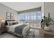 Serene bedroom with mountain views through large windows and neutral decor at 4575 Dean Martin Dr # 1208, Las Vegas, NV 89103
