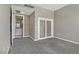 Bedroom features include gray carpet, access to a bathroom, and frosted glass closet doors at 4575 Dean Martin Dr # 1208, Las Vegas, NV 89103