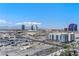 Elevated city view featuring modern buildings and distant mountains at 4575 Dean Martin Dr # 1208, Las Vegas, NV 89103