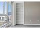 Bedroom closet with adjustable shelving, large window, and city view at 4575 Dean Martin Dr # 1208, Las Vegas, NV 89103