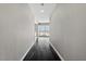 Long hallway with dark hardwood floors leading to a bright living space at 4575 Dean Martin Dr # 1208, Las Vegas, NV 89103