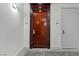 Hallway with a wooden door and a gray carpet at 4575 Dean Martin Dr # 1208, Las Vegas, NV 89103