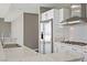 Close-up of a kitchen featuring stainless steel appliances, white cabinetry, and patterned countertops at 4575 Dean Martin Dr # 1208, Las Vegas, NV 89103
