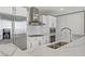 Modern kitchen features stainless steel appliances, white cabinets, and white and gray patterned countertops at 4575 Dean Martin Dr # 1208, Las Vegas, NV 89103