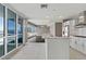 Bright open concept with a modern kitchen featuring a large island and stunning city views at 4575 Dean Martin Dr # 1208, Las Vegas, NV 89103