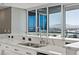 Bright kitchen with stunning city views through large windows, and white and gray patterned countertops at 4575 Dean Martin Dr # 1208, Las Vegas, NV 89103